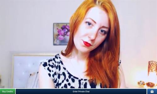 Fiery redhead cam girl in her free sex chat room